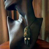 Hand carved New Zealand Jade squid pendant. Hand made Jade Squid pendant with Mother of Pearl eyes, provided with black adjustable cord.